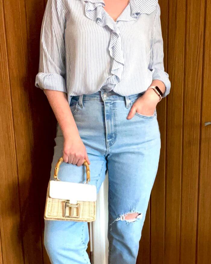 girl wearing blue and white striped shirt and jeans